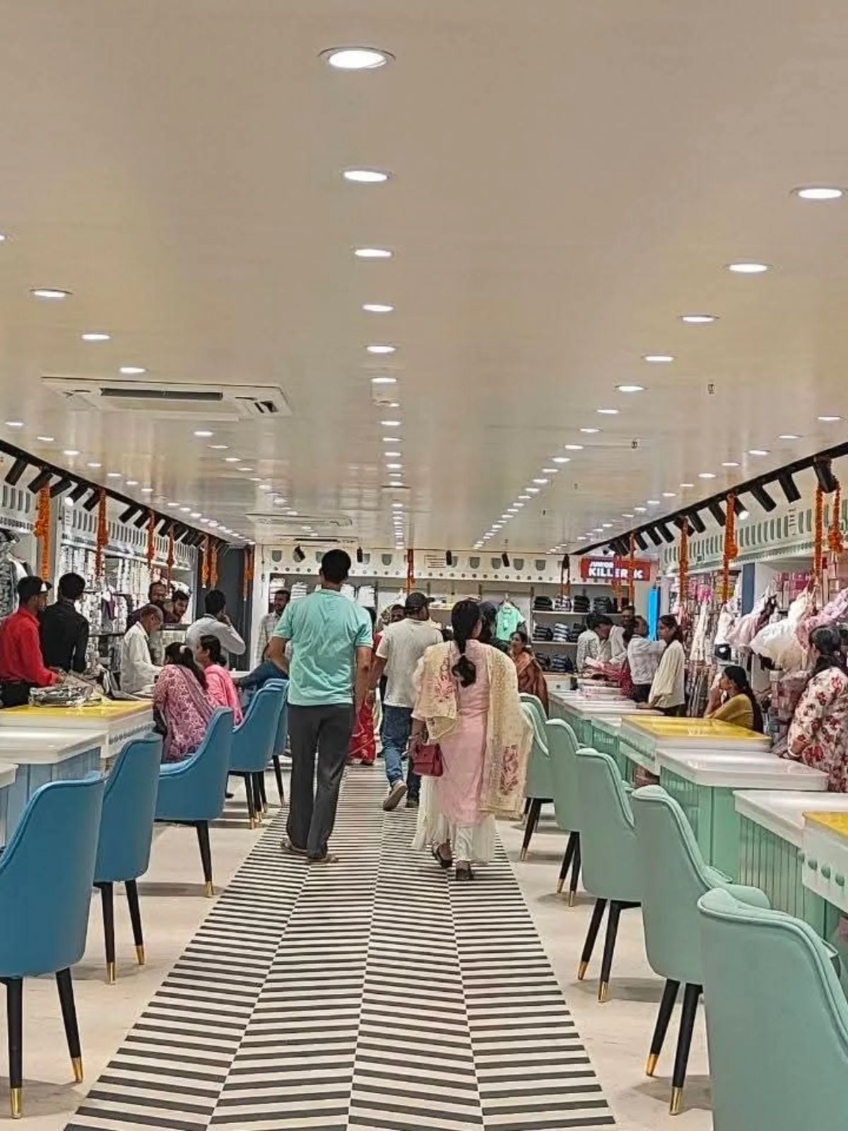 Bright, spacious interior aisle of RM Shopping Centre